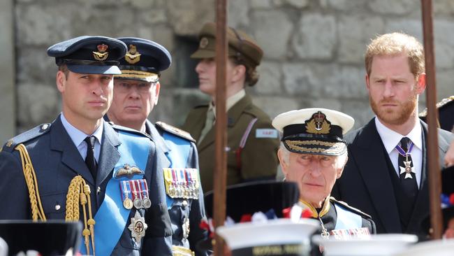 Prince William, King Charles III and Prince Harry watch the coffin of HM Queen Elizabeth during her State Funeral. Picture: Getty Images.