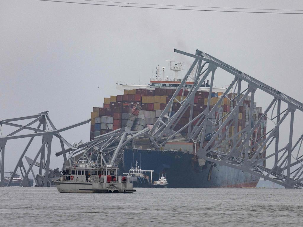 Workers continue to investigate and search for victims after the cargo ship Dali collided with the Francis Scott Key Bridge causing it to collapse. Picture: AFP/Getty Images