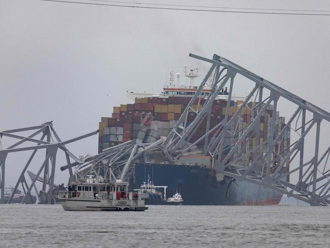 Workers continue to investigate and search for victims after the cargo ship Dali collided with the Francis Scott Key Bridge causing it to collapse. Picture: AFP/Getty Images