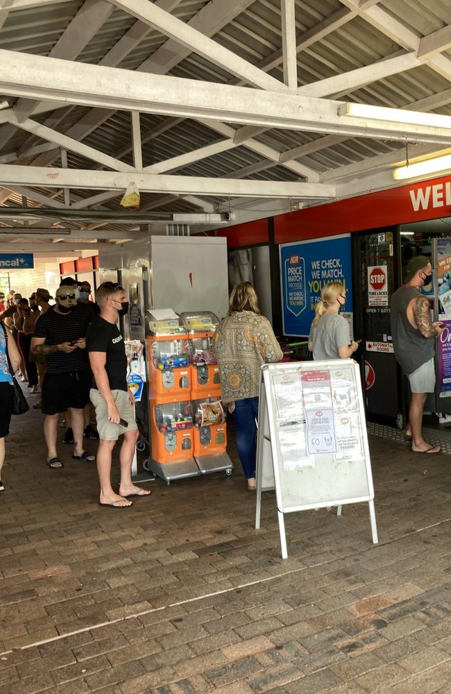 People queue outside Currumbin Fair IGA for rapid antigen tests. Photo: Greg Stolz