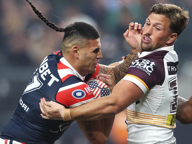 LAS VEGAS, NEVADA - MARCH 02: TerrellÃÂ May of the Roosters is tackled by Tyson Smoothy of the Broncos during the round one NRL match between Sydney Roosters and Brisbane Broncos at Allegiant Stadium, on March 02, 2024, in Las Vegas, Nevada. (Photo by Ezra Shaw/Getty Images)