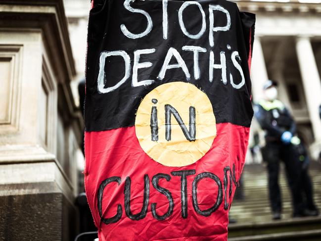 MELBOURNE, AUSTRALIA - JUNE 06: Protesters march in Bourke Street  on June 06, 2020 in Melbourne, Australia. Events across Australia have been organised in solidarity with protests in the United States following the killing of an unarmed black man George Floyd at the hands of a police officer in Minneapolis, Minnesota and to rally against aboriginal deaths in custody in Australia. (Photo by Darrian Traynor/Getty Images)