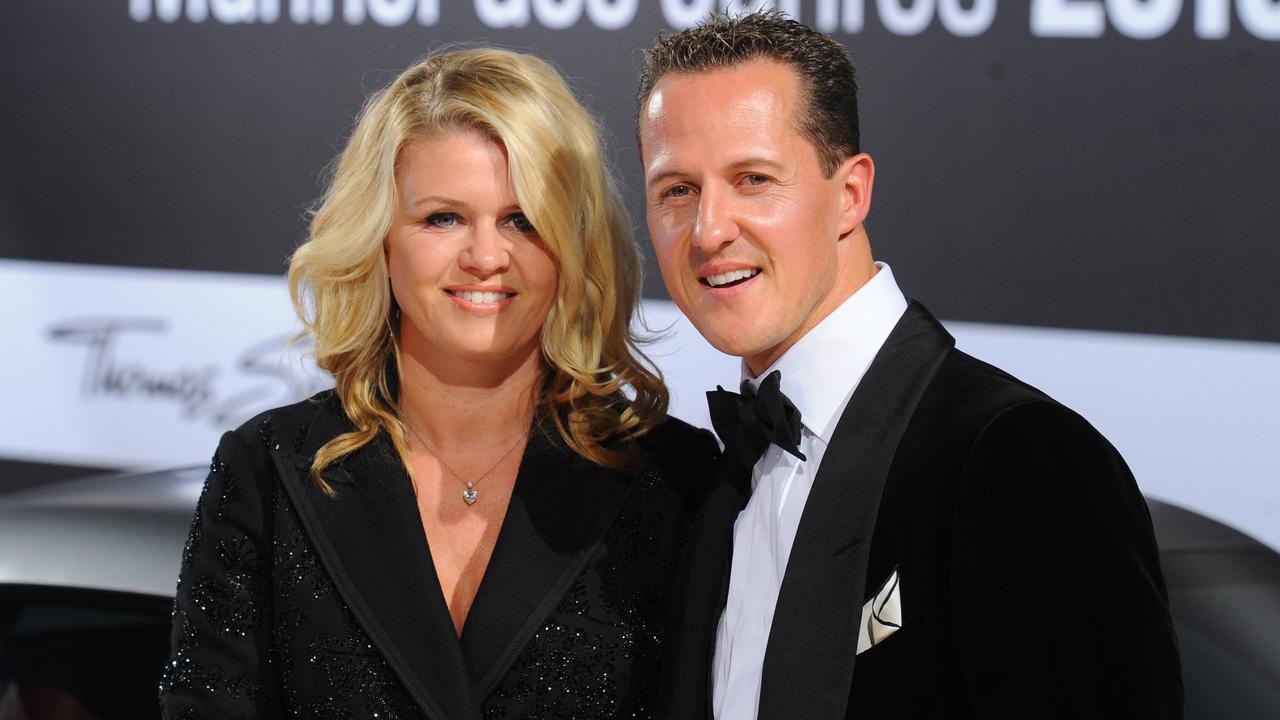 Michael Schumacher and wife Corinna. AFP PHOTO / JENS KALAENE GERMANY OUT / AFP PHOTO / DPA / JENS KALAENE