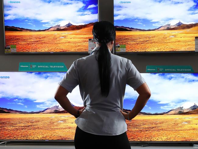 A woman looking at televisions for sale, Harvey Norman, Homemaker Centre, Newstead. Photographer: Liam Kidston.