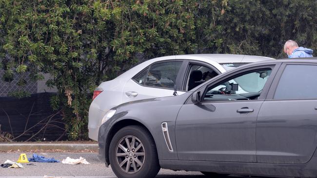 Police are examining the silver Corolla. Picture: Andrew Henshaw