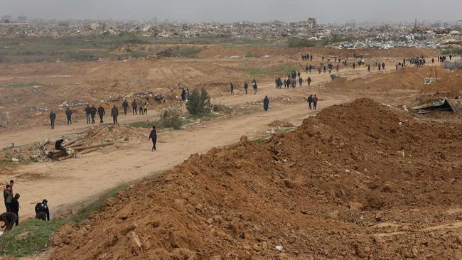 Displaced Palestinians cross the Netzarim corridor. Picture: AFP.