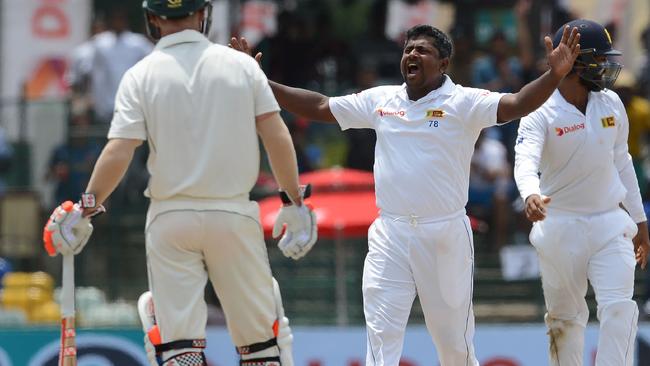 Rangana Herath celebrates a wicket against Australia.