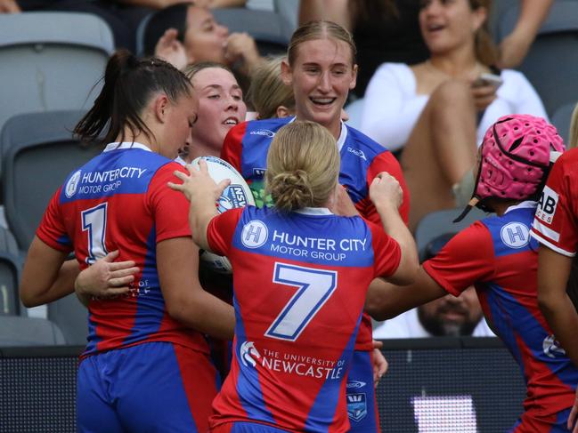 Newcastle celebrate Lilly McNamara’s opening try. Picture: Warren Gannon Photography