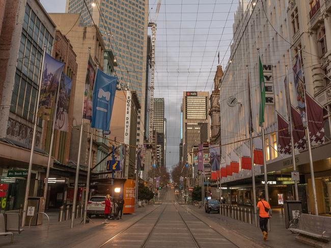 MELBOURNE, AUSTRALIA - AUGUST 06: A quiet Bourke Street mall is seen on August 06, 2020 in Melbourne, Australia.  Retail stores across Melbourne are closed to customers as part of further stage 4 lockdown restrictions implemented in response to Victoria's ongoing COVID-19 outbreak.  The majority of retail businesses like clothing, furniture, electrical and department stores will be closed to the public for the duration of the stage 4 restrictions. Businesses will be able to operate click and collect services with social distancing and contactless payments. Supermarkets, grocery stores, bottle shops, pharmacies, petrol stations, banks, news agencies and post offices will remain open during the lockdown. Melbourne residents are subject to a curfew from 8 pm to 5 am, must stay within a 5km radius of their homes along with limits on hours of exercise, while all students have returned to home learning and childcare centres have closed. (Photo by Asanka Ratnayake/Getty Images)