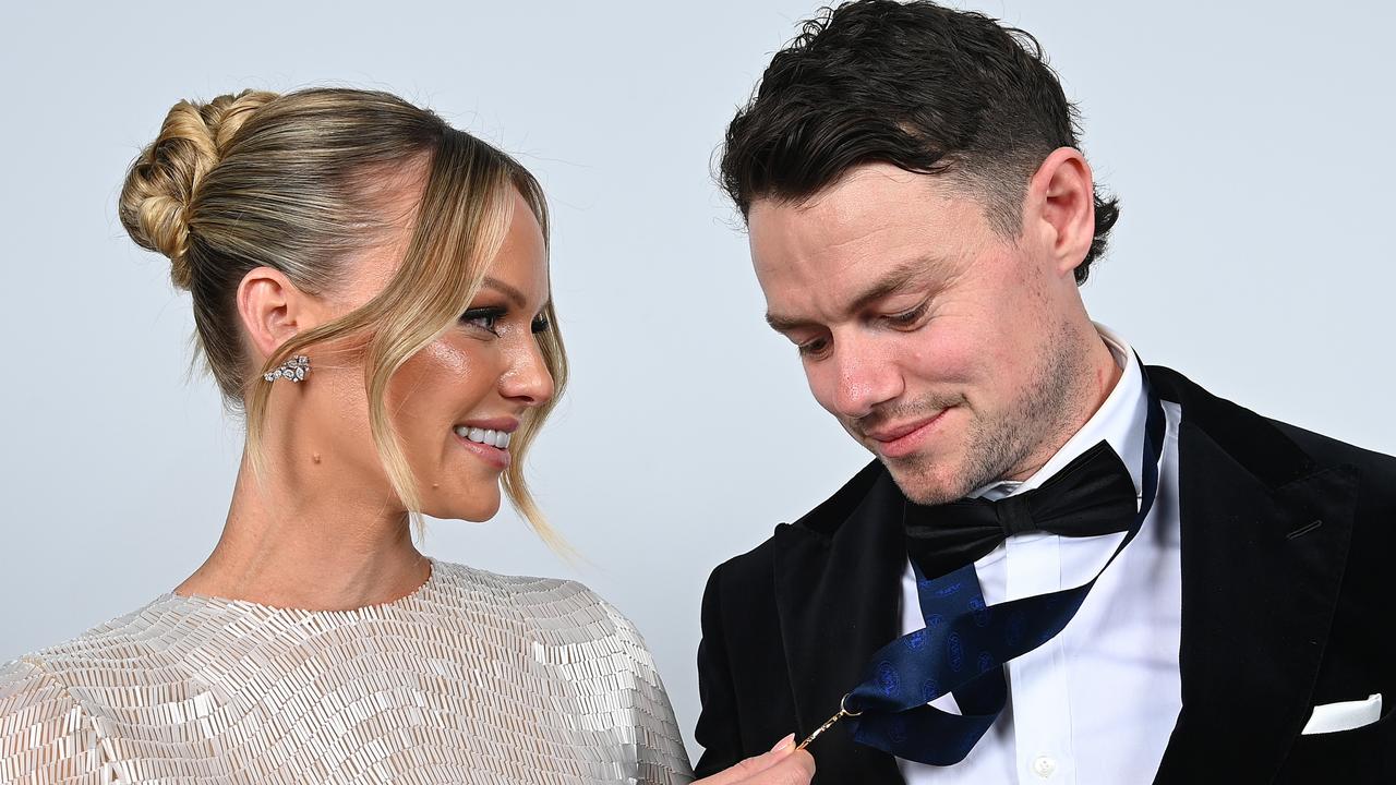 Dual Brownlow medallist Lachie Neale with his wife Jules after winning the game’s highest honour on Monday night. Picture: Albert Perez / Getty Images