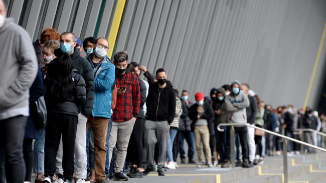 People queue for Covid vaccines at the Melbourne Convention and Exhibition Centre in 2021. Picture: Andrew Henshaw