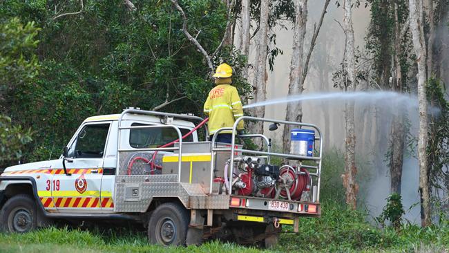 The NT Fire and Rescue Palmerston crew fighting the Bushfires at Coolalinga last fire season. Picture: Julianne Osborne