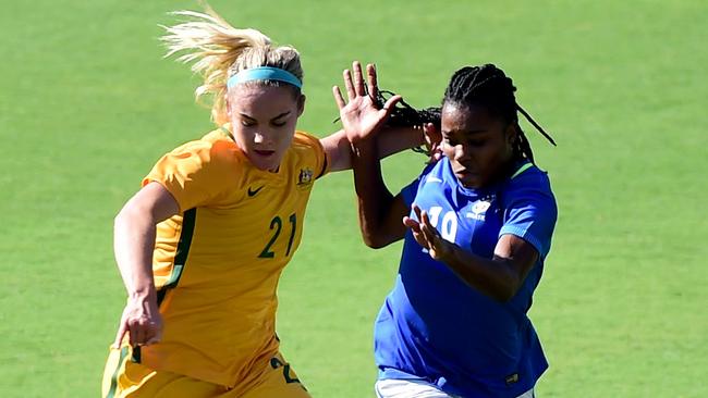 Ellie Carpenter fends off Ludmila at the Tournament of Nations.