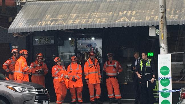 Police and SES members in Elsternwick this morning. Picture: Chanel Zagon