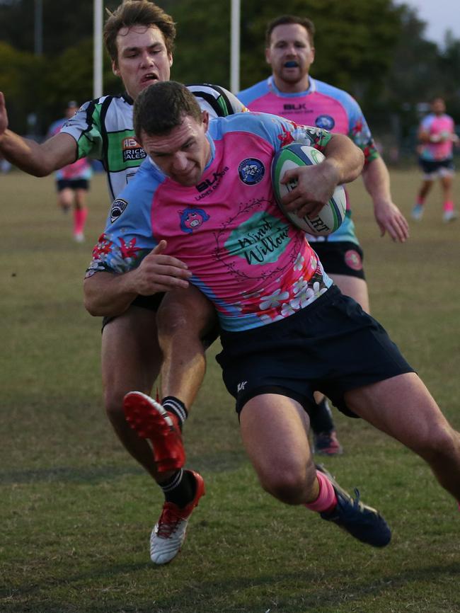 Helensvale’s Tom Eastwell keeps Palm Beach Currumbin defender Corey Morris at bay to score on Saturday. Picture: Glenn Hampson