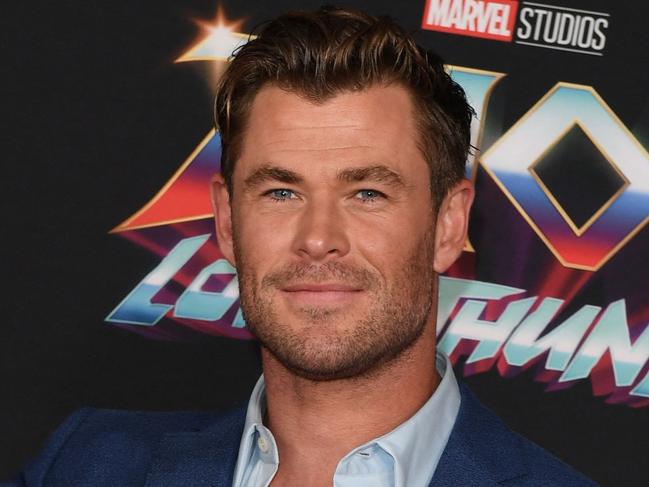 (FILES) In this file photo taken on June 23, 2022, Australian actor Chris Hemsworth arrives for Marvel Studios "Thor: Love And Thunder" world premiere at the El Capitan theatre in Los Angeles, California. - Marvel's latest superhero flick "Thor: Love and Thunder" pounded opponents for a second straight week to top the North American box office with an estimated $46 million haul, industry watcher Exhibitor Relations reported on July 17, 2022. (Photo by VALERIE MACON / AFP)