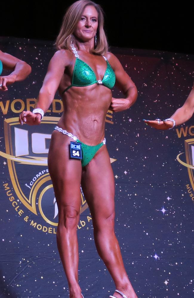 Natalie Joyce weighed 70kg before her bodybuilding transformation. Now she’s shy of 55kg. Here’s she’s pictured in a green bikini in her first bodybuilding competition. Picture: Ignacio Tse