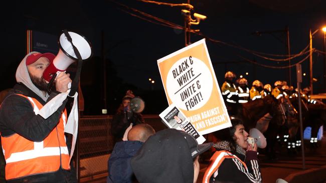 Anti-fascist protesters rally against far-right commentator Lauren Southern at Broadmeadows station. Picture: AAP Image/Stefan Postles