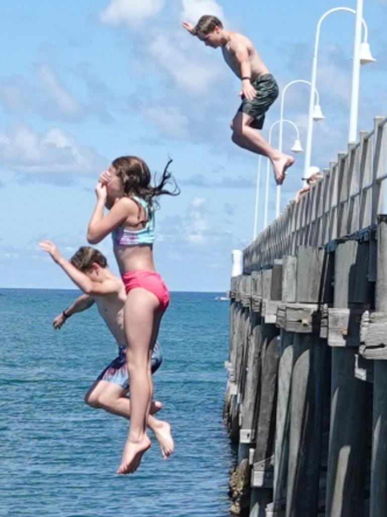 Siblings Rishayni, Ezra and Seth Butterman are cleared for takeoff. Picture: Chris Knight