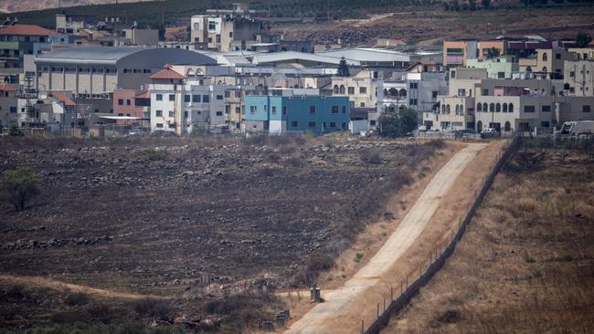 The Blue line dividing Israel (L) and Lebanon (R) is seen looking towards the Lebanese border town of Aadaysit from the base of U.N. peacekeepers. Picture: Getty Images