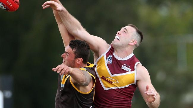 Patrick Flynn wins the tap over Dylan Chapman. Picture: Hamish Blair