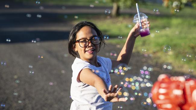 Chlouie Lavers plays with bubbles at Toowoomba Royal Show, Thursday, March 30, 2023. Picture: Kevin Farmer