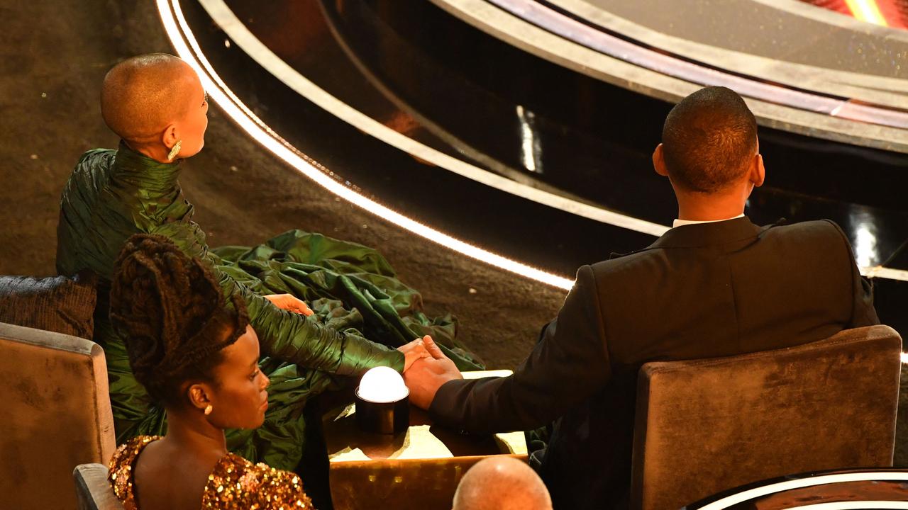 Will Smith (R) sits alongside US actress Jada Pinkett Smith. Picture: Robyn Beck / AFP