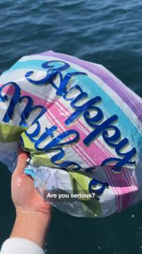 'Heartbreaking' moment family pulls dozens of balloons from the sea