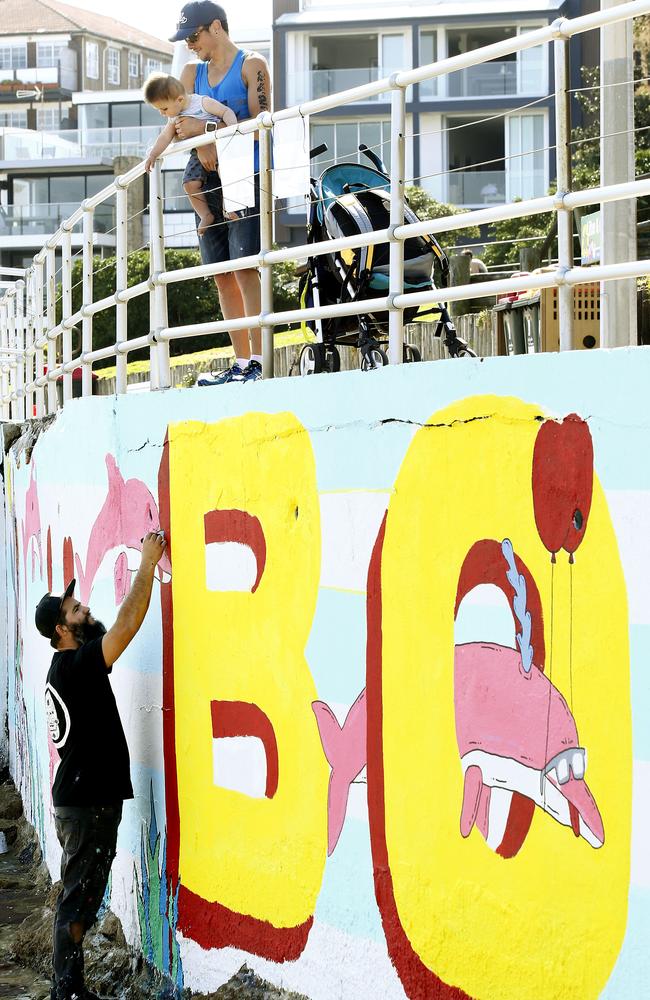 Mulga the artist working on one of the current murals back in 2016. Picture: John Appleyard