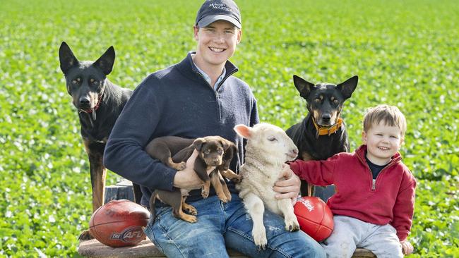 Bridgewater North’s Andy Collins, his son Freddie, 2, and others on the farm where workplace safety is of utmost importance. Picture: Zoe Phillips