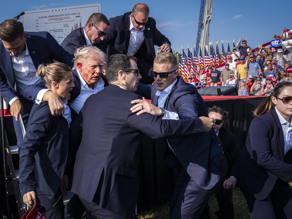 Secret Service agents rush Donald Trump off the stage. Picture: Jabin Botsford/The Washington Post/Getty Images