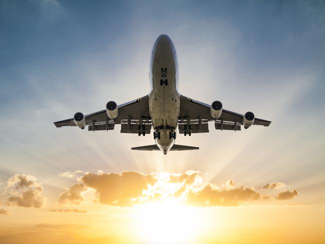 Passenger airplane taking off at sunsetEscape 27 October 2024Kendall HillPhoto - iStock