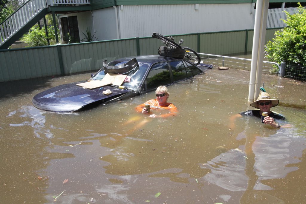 Kerrin and his father Steve Manski are making the best of a bad situation by having a beer and relaxing in the water. Robyne Cuerel/ Fraser Coast Chronicle. Picture: Robyne Cuerel