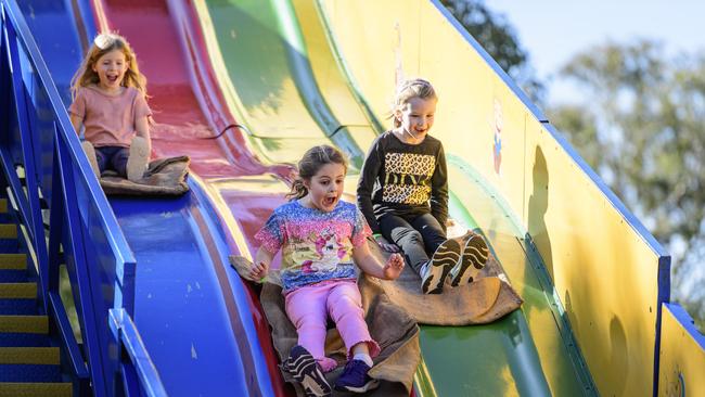 On the giant slide are (from left) Hailey Masterman, Emma Hurst and Flossy Lindeblad at Sadie's Day Out. The event, a special celebration of the life of five-year-old crash victim Sadie, was held at Cambooya State School, Saturday, June 7, 2025. Picture: Kevin Farmer