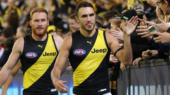 Shane Edwards and Nick Vlastuin celebrate with fans after beating Carlton last year. Picture: George Salpigtidis