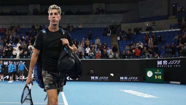 A dejected Thanasi Kokkinakis walks off the court after losing a marathon five-set match to Andy Murray. Picture: Clive Brunskill/Getty Images