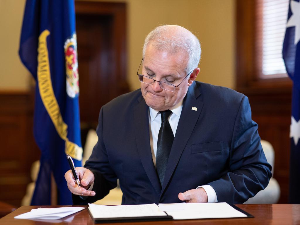 Australian Prime Minister Scott Morrison photographed signing a book of condolence at Government Hour in Sydney to pay his respects to HRH Prince Philip. Picture: Julian Andrews