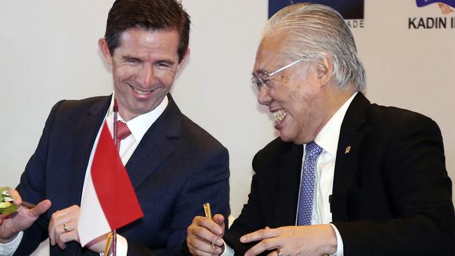 Australian Trade Minister Simon Birmingham, left, and Indonesian Trade Minister Enggartiasto Lukita sign a free-trade agreement between the two countries in Jakarta yesterday. Picture: Achmad Ibrahim/AP