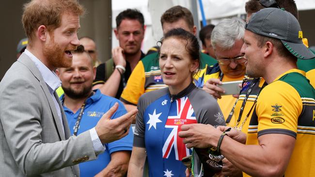 Invictus Games competitor Ben Yeomans offers Prince Harry a pair of budgie smugglers. Picture: Jonathan Ng