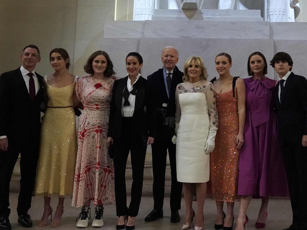 Mr and Dr Biden pose with their family in front of the statue of Abraham Lincoln at the "Celebrating America" event at the Lincoln Memorial after his inauguration. Picture: Joshua Roberts / pool / AFP