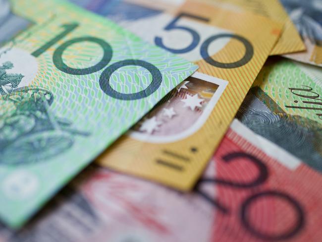 Australian money background showing $100, $50 and $20 notes with a shallow depth of field.