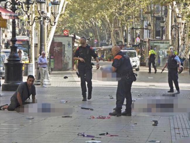 Harry Athwal, pictured left, with a young boy. A woman’s body is pictured nearby. Picture: Alamy