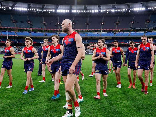 Max Gawn leads the Demons off after their loss to Collingwood. Picture: Dylan Burns/AFL Photos via Getty Images