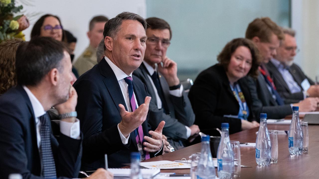 Defence Minister Richard Marles and former defence chief Sir Angus Houston with members of Australia’s strategic policy community at Russell offices in Canberra. Picture: Kym Smith