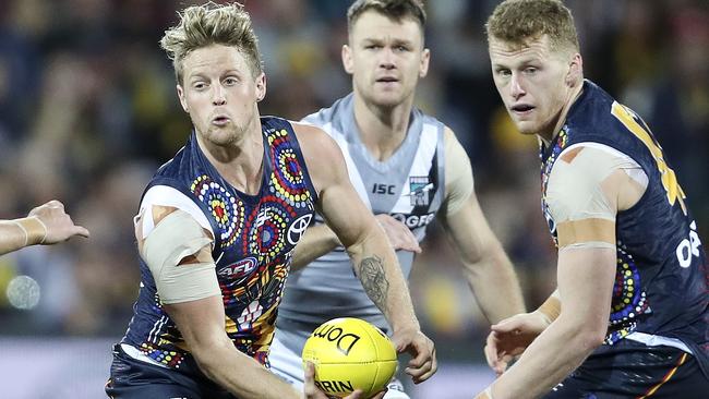 Crows captain Rory Sloane dishes out a handball in Showdown 47 last year. Picture: Sarah Reed