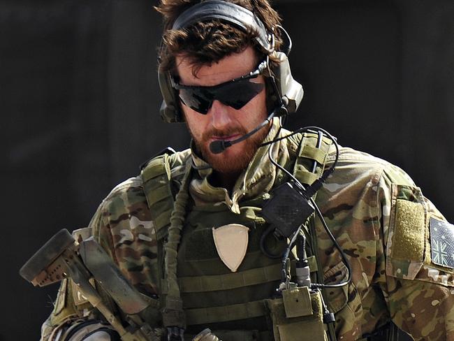 SAS Corporal Ben Roberts-Smith VC, MG, with the Australian Special Operations Task Group, leaves a UH-60 Blackhawk helicopter during preparation of the Shah Wali Kot offensive in Afghanistan, 06/2010. Roberts-Smith was later awarded the Victoria Cross during action in saving the lives of wounded comrades.
