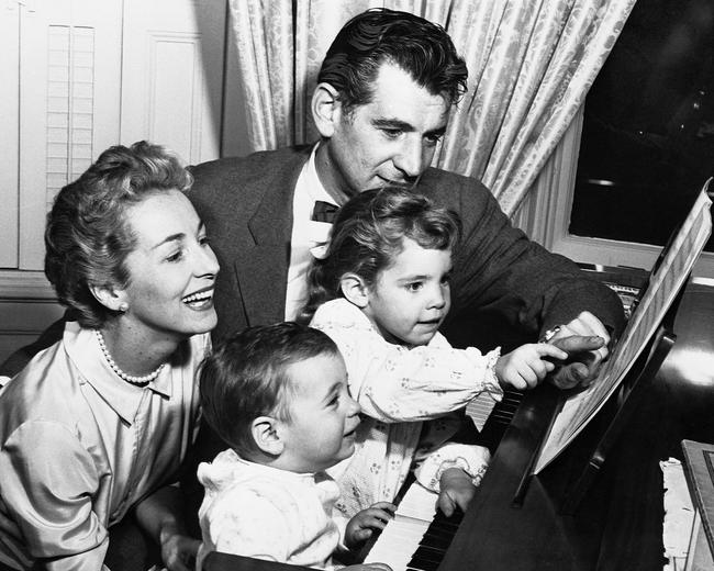 Composer/conductor Leonard Bernstein, 39, at home with his wife Felicia Montealegre and sons, Jamie (pointing) and Alexander Serge in 1957, on the day he was appointed to head the New York Philharmonic, the first American-born, American-trained conductor to do so.