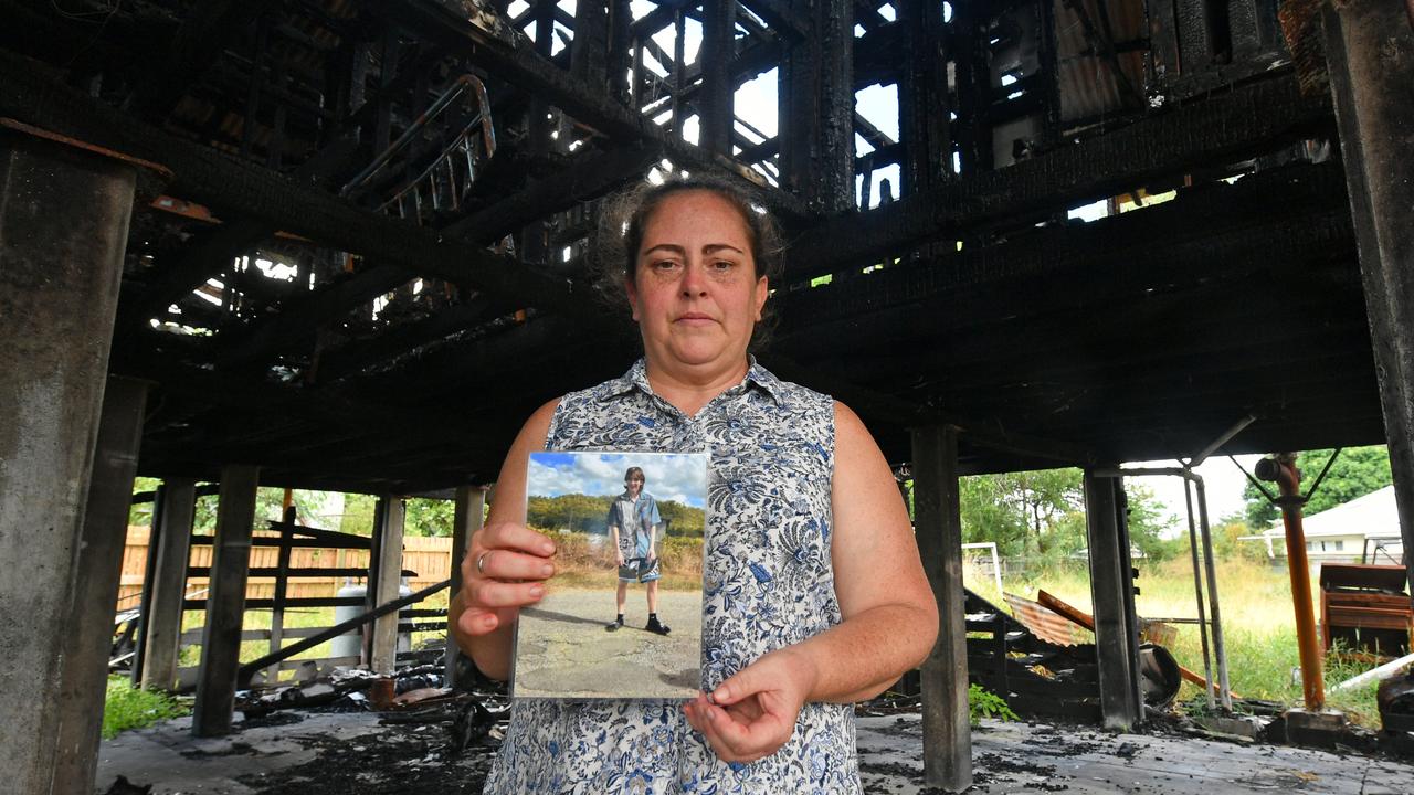 Christie Stonehouse with a picture of her son Ben at the Garbutt house where he was killed after a fire. Picture: Evan Morgan