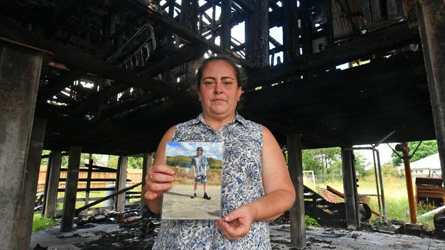 Christie Stonehouse with a picture of her son Ben at the Garbutt house where he was killed after a fire. Picture: Evan Morgan