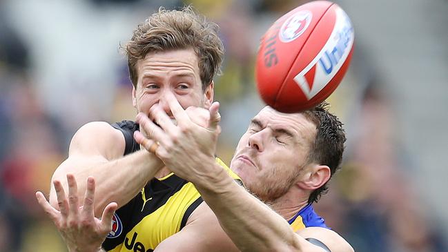 AFL Round 22. 18/08/2019. Richmond v West Coast at the MCG .   Richmonds Kane Lambert  clears infant of West Coast's Luke Shuey    . Pic: Michael Klein